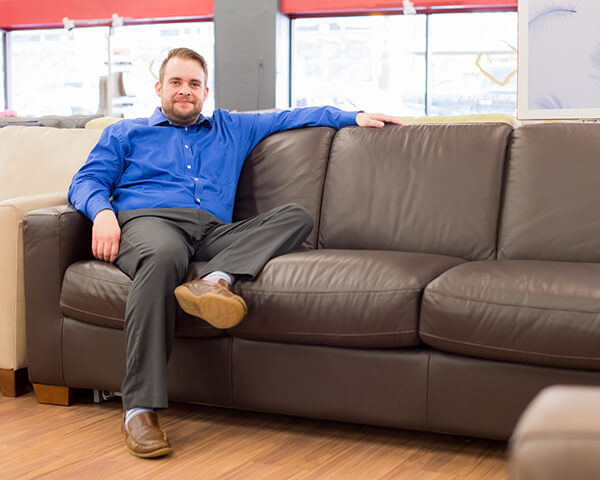 Jake relaxes on Natuzzi leather sleeper sofa