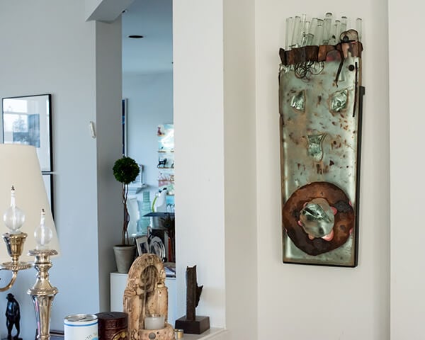 Curating and Displaying Art: Glass Face on Wall
